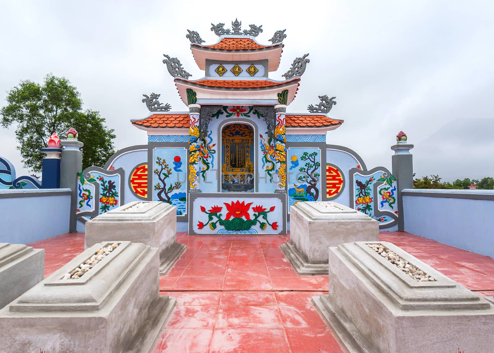 Vietnam Quang Binh: Detail of family grave plot and shrine on cemetery. by Claudine