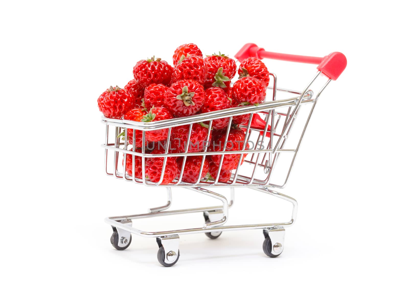 Ripe Red strawberries in shopping cart, on white background