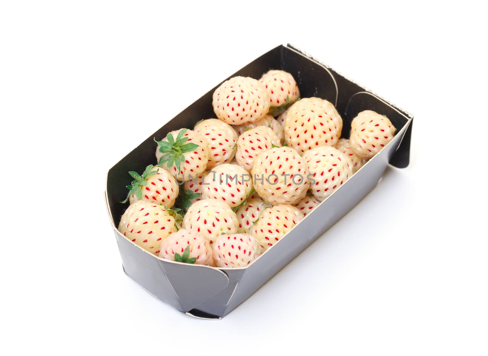 White strawberries in paper box, closeup on white background 