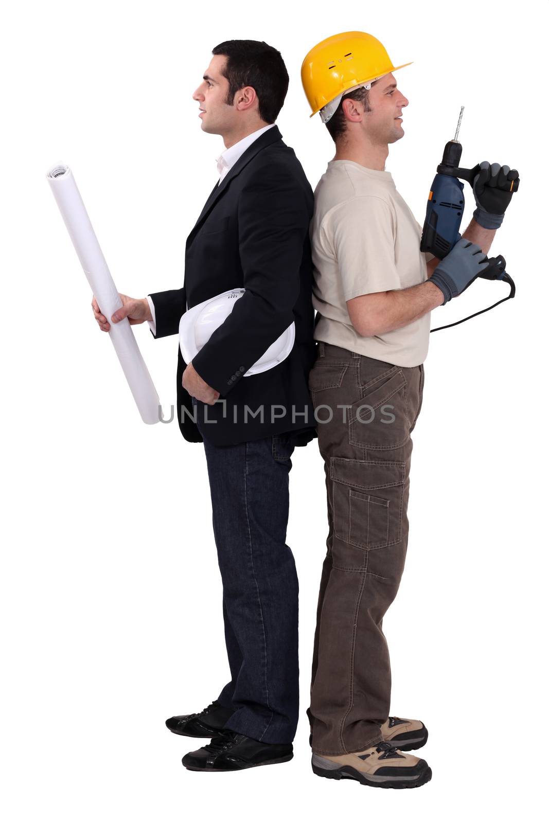 Tradesman and engineer standing back to back by phovoir