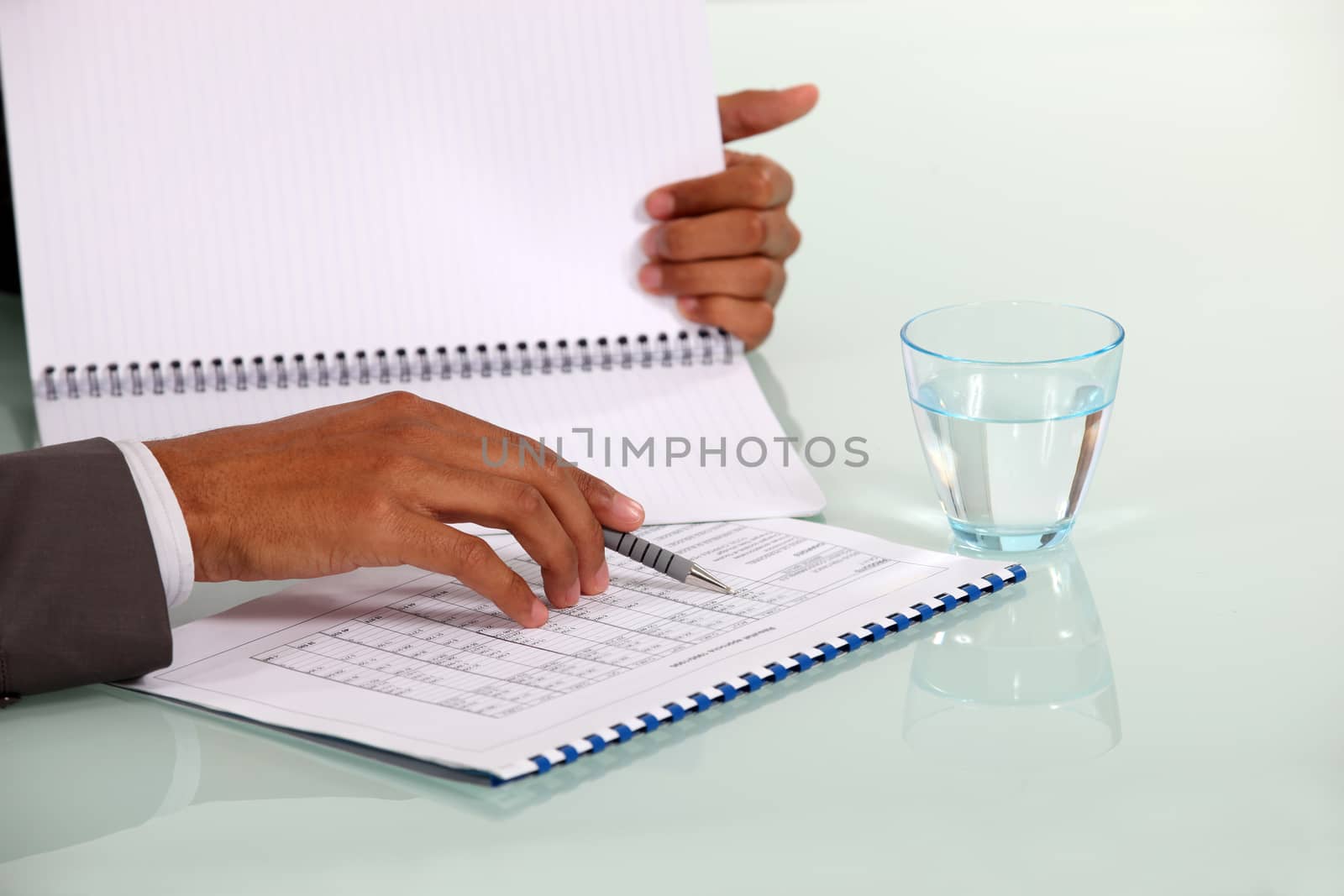 Man checking data on a notebook