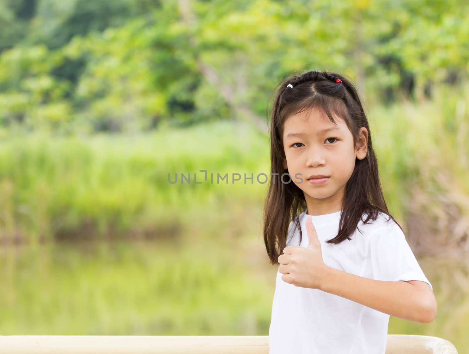 Outdoors portrait of beautiful Asian young girl