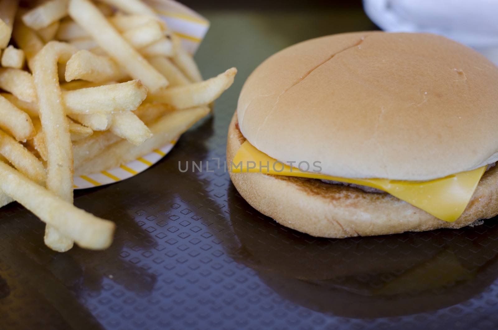french fries with hamburger on dish in restaurant
