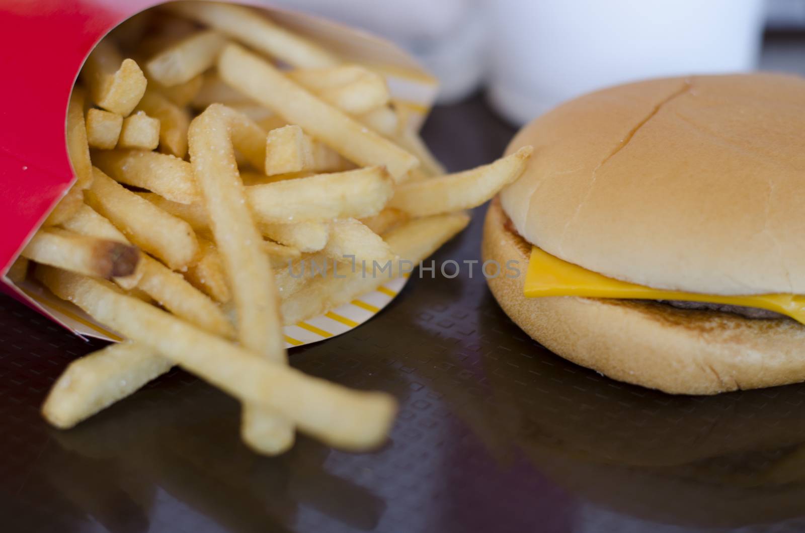 french fries with hamburger on dish in restaurant