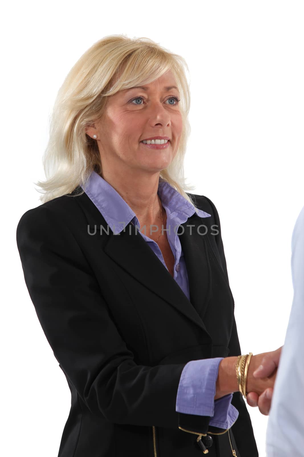 Woman shaking hands with a client by phovoir