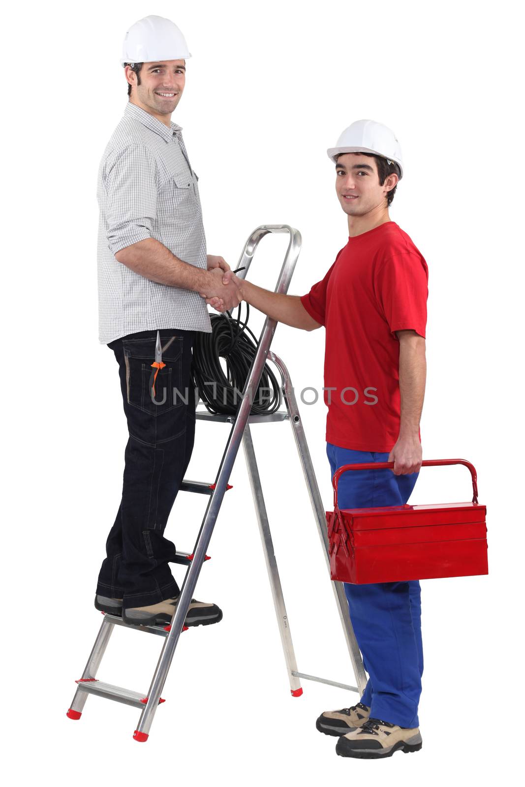 Electricians shaking hands by phovoir