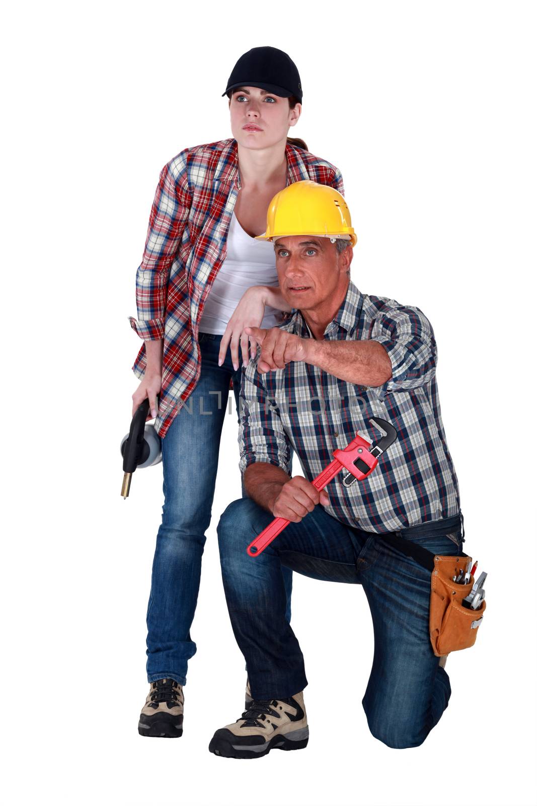Man and woman plumbers by phovoir
