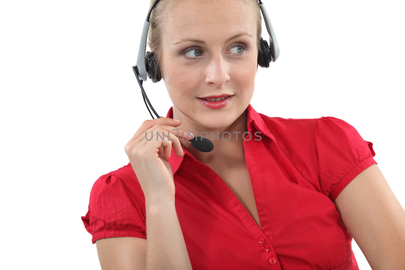 Blond receptionist using telephone head-set