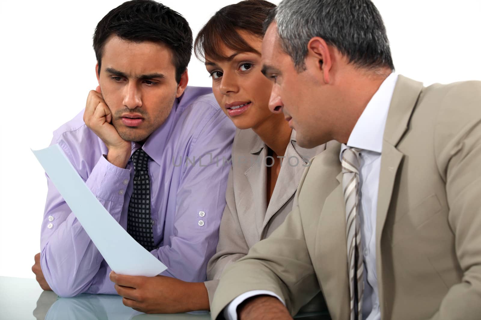 Three professionals in meeting