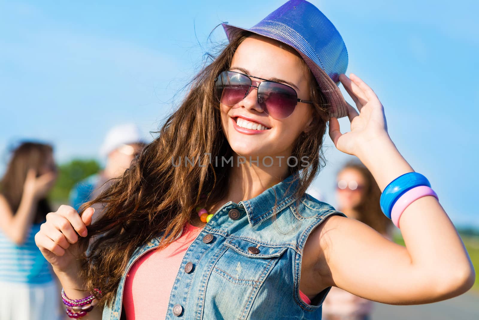 stylish young woman in sunglasses by adam121