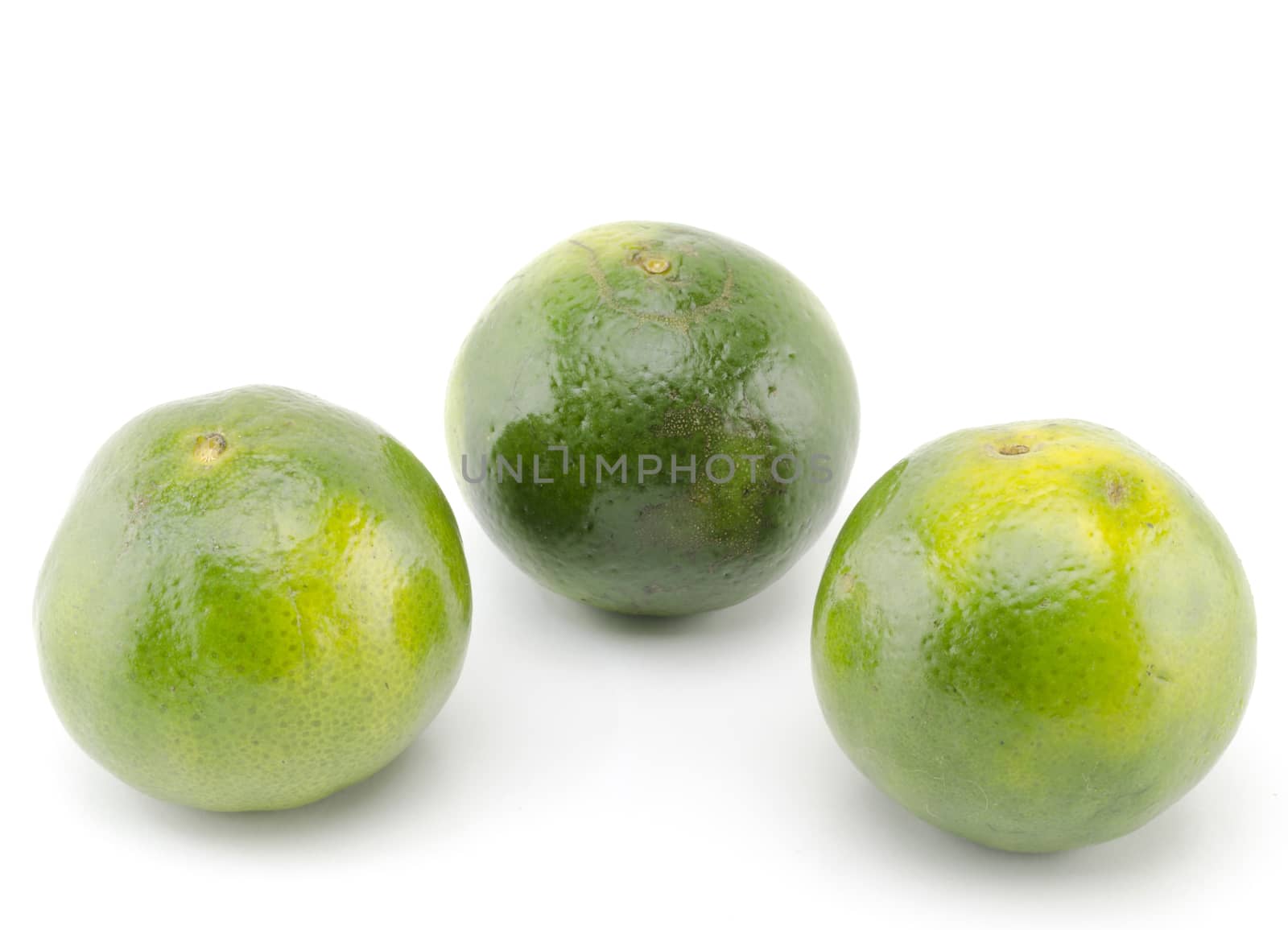 three green orange fruit isolated on white background