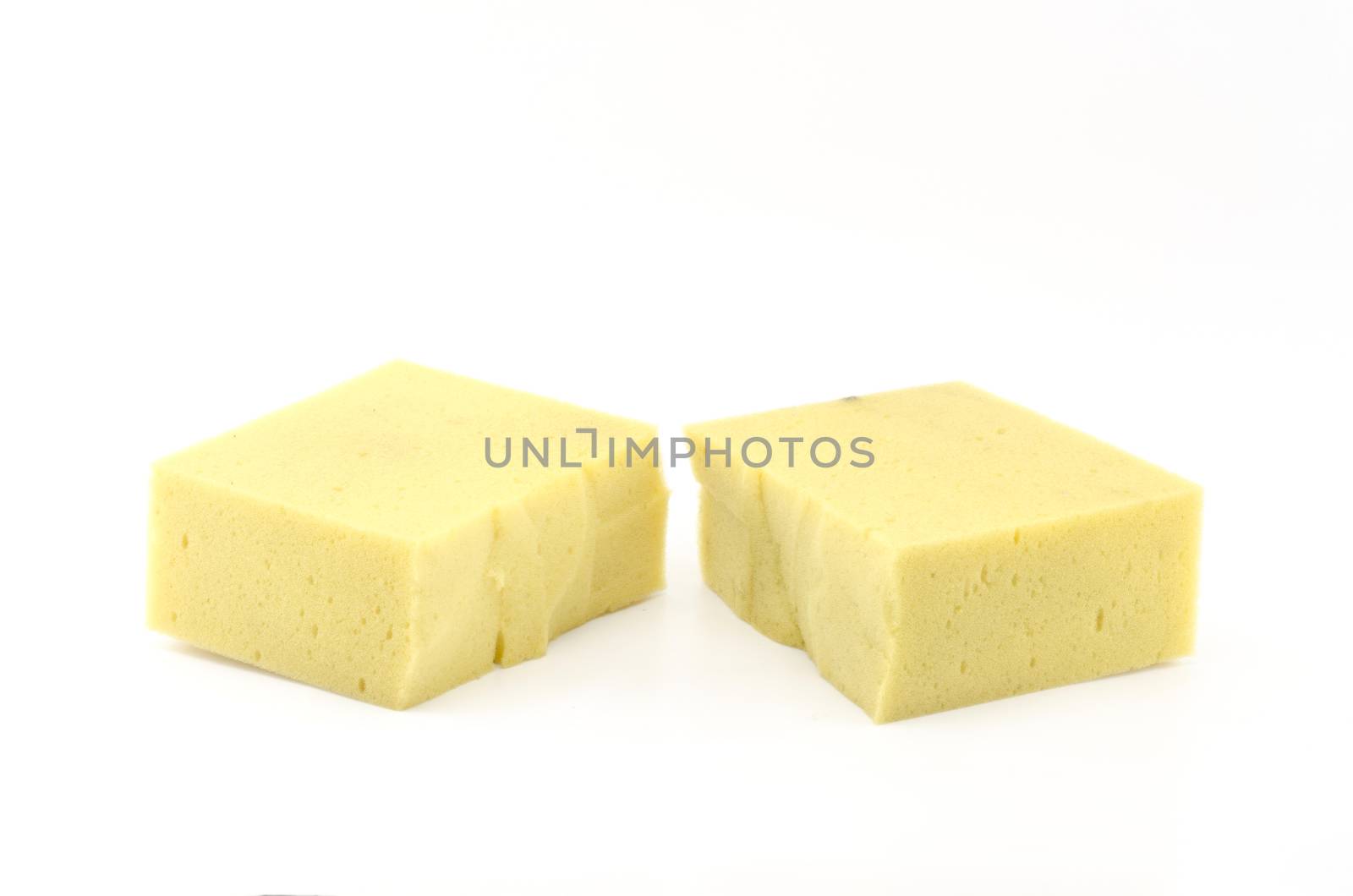 two piece yellow household sponge isolated on white background by ammza12