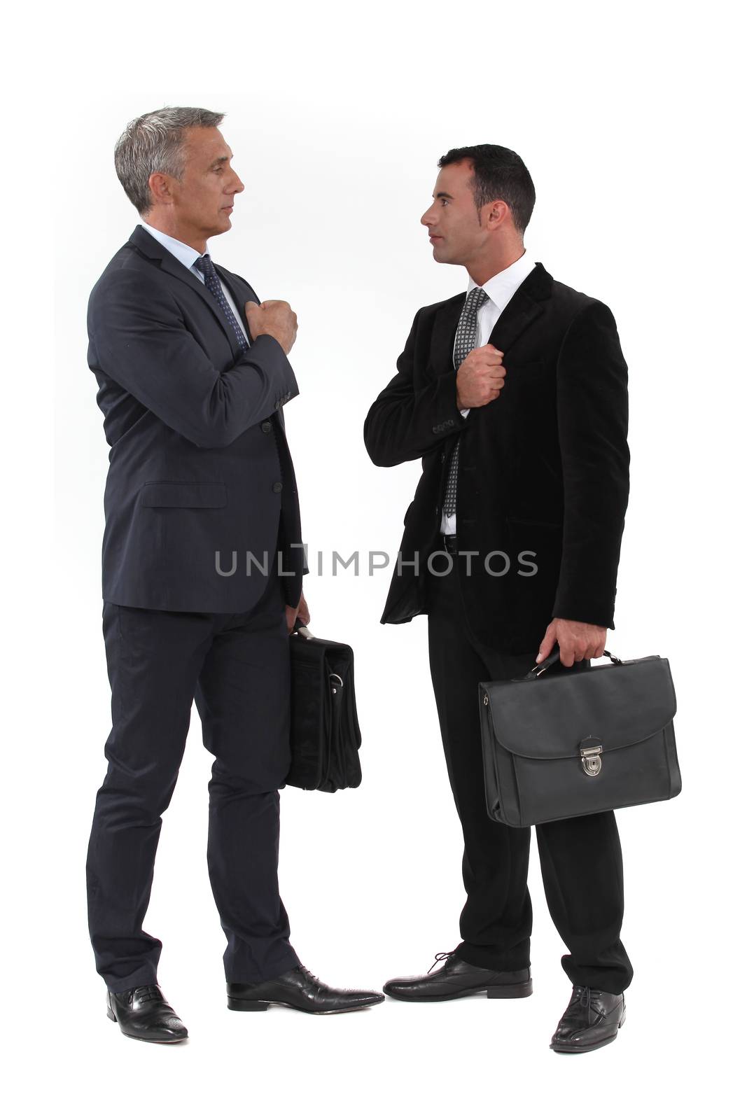 Businessmen trying to build up their morale before an important meeting