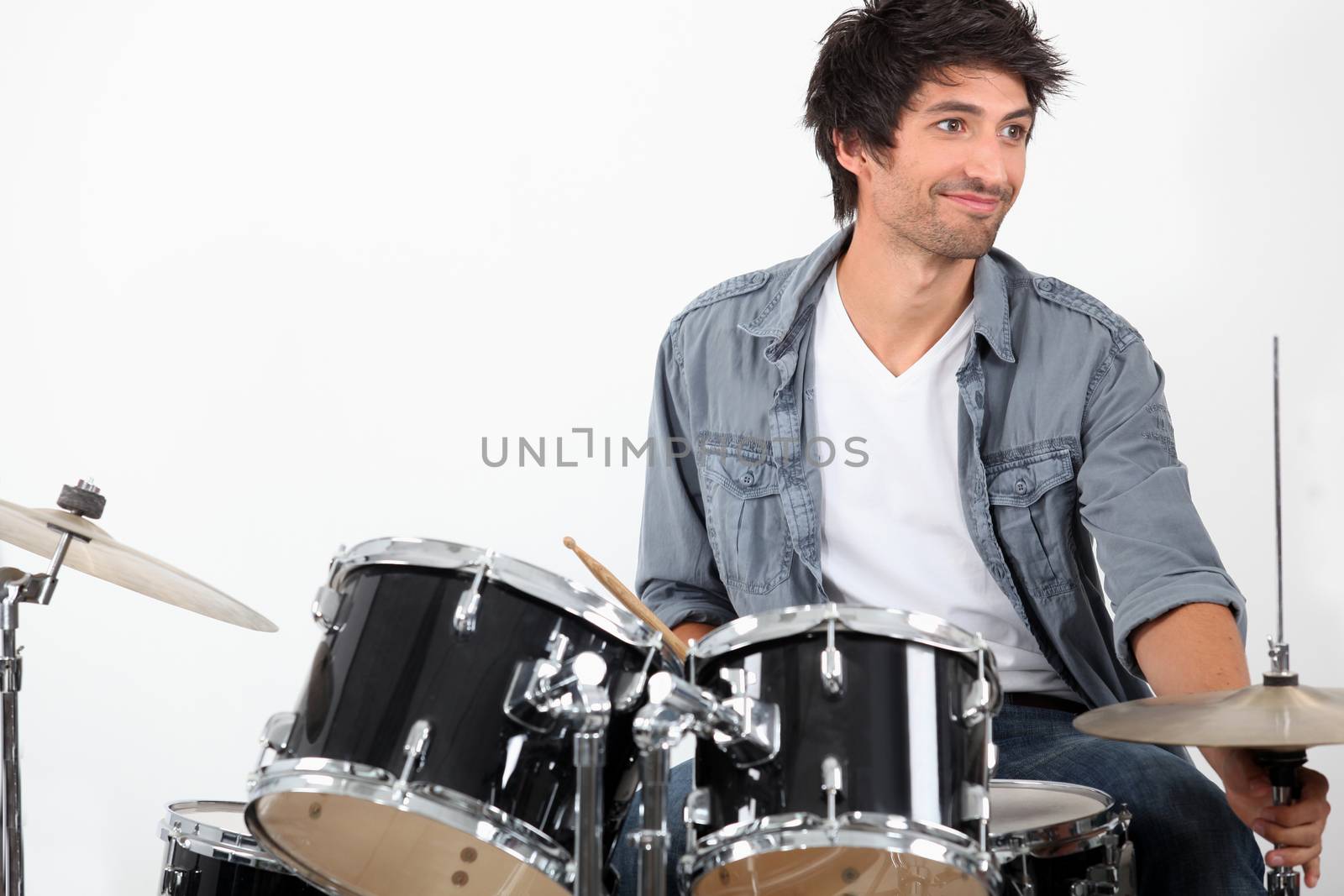 Young playing drums