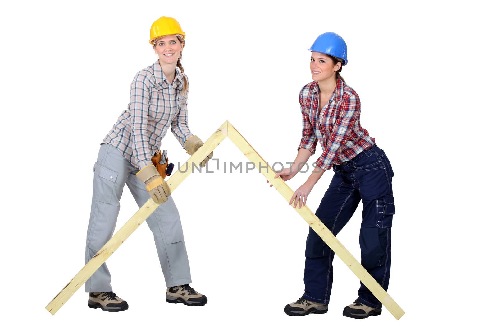 Tradeswomen building a frame