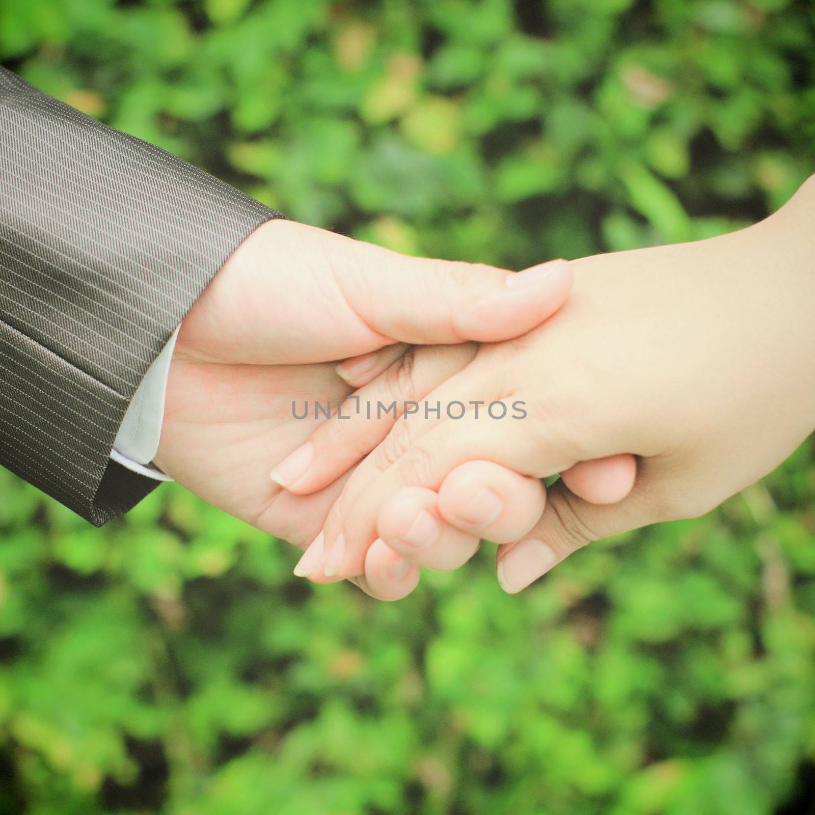 Married couple holding hands in wedding day by nuchylee