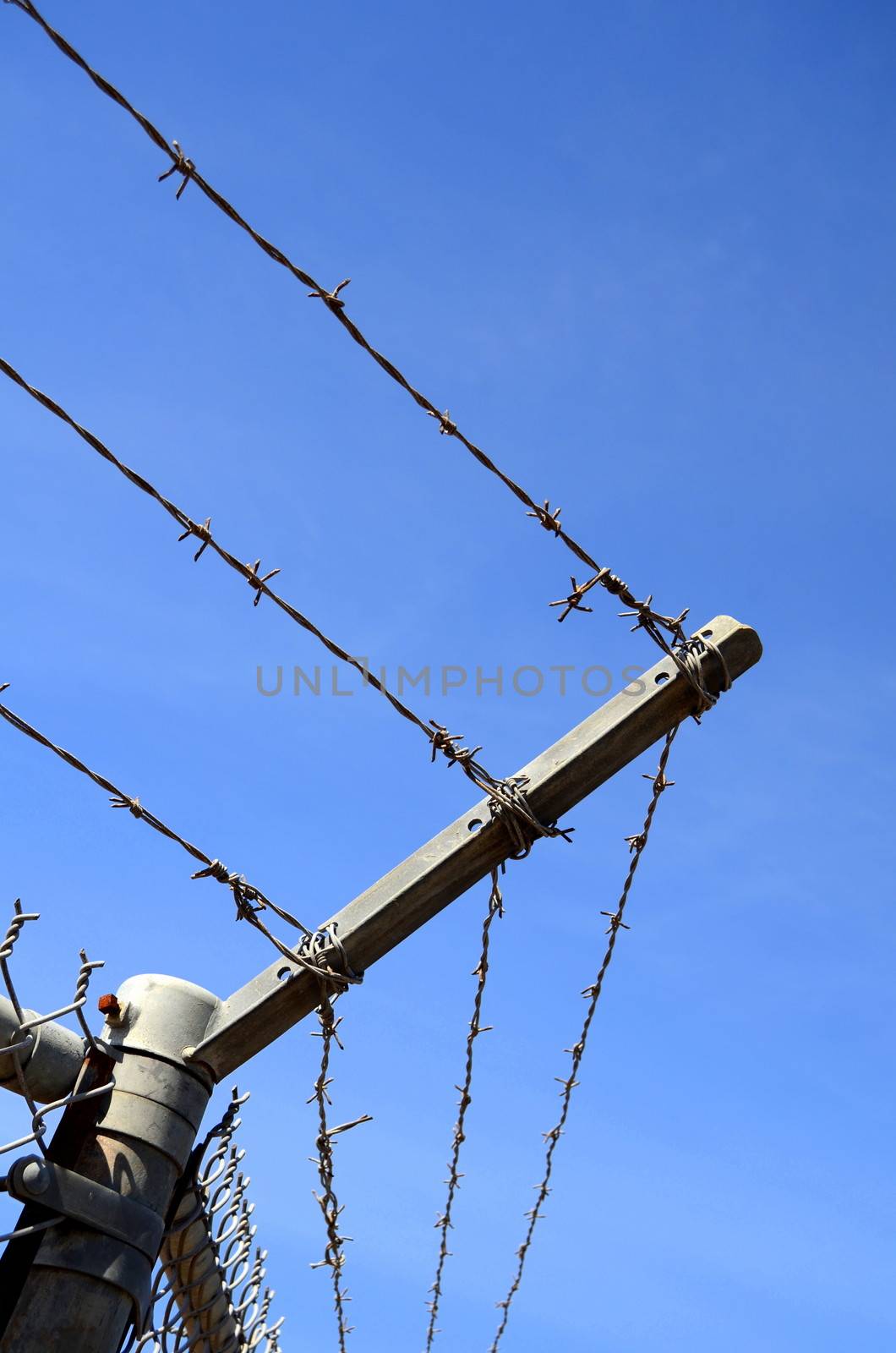 Detail Of A High Security Barbed Wire Fence With Copy Space