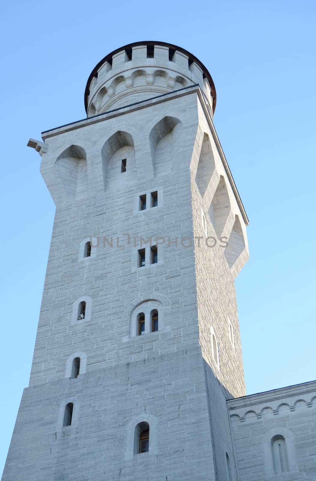 Architecture Detail Of A Tower Of A Castle Against A Blue Sky