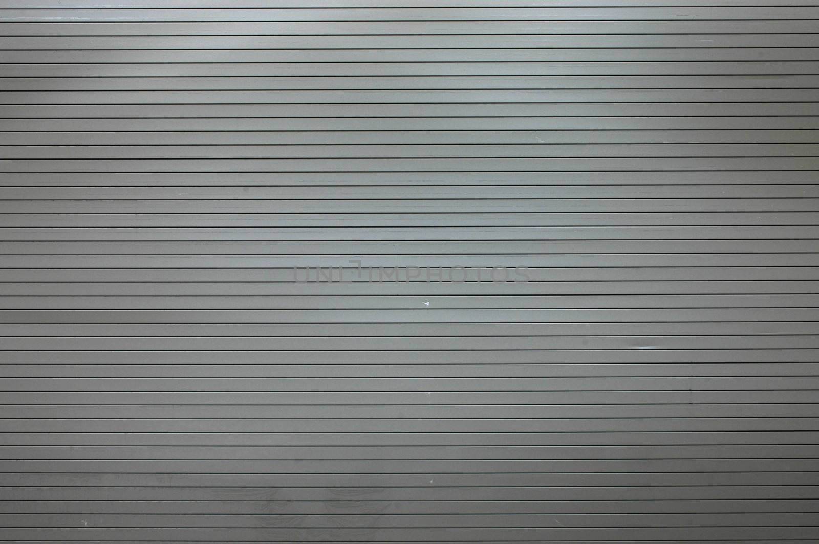 Abstract background texture of scuffed shop shutters