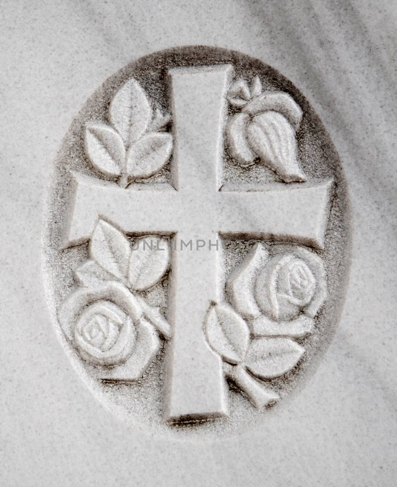 Christian Image Of A Crucifix And Flowers On A Gravestone