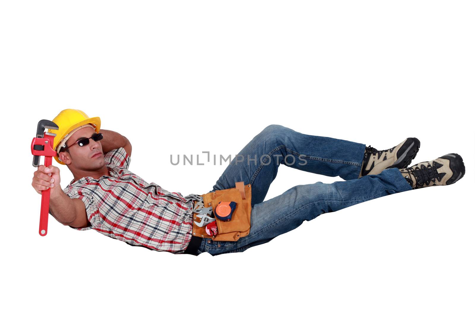 Relaxing workman with a wrench
