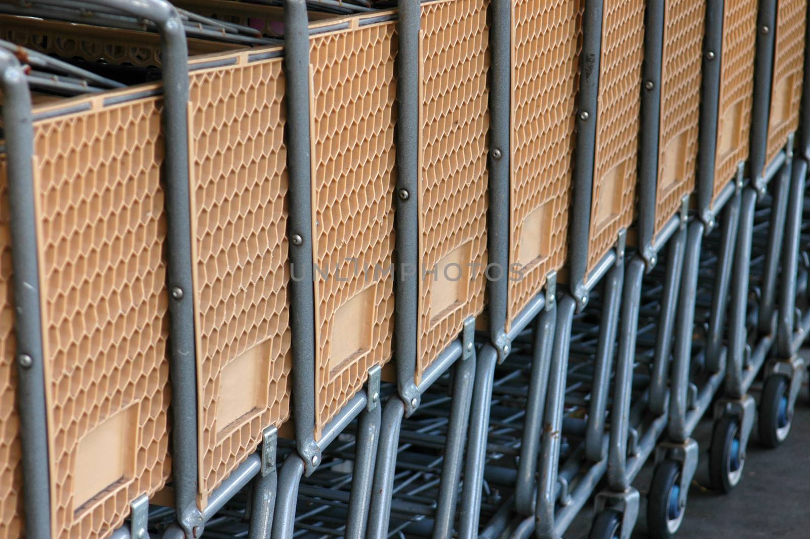 Retail image of a row of supermarket carts