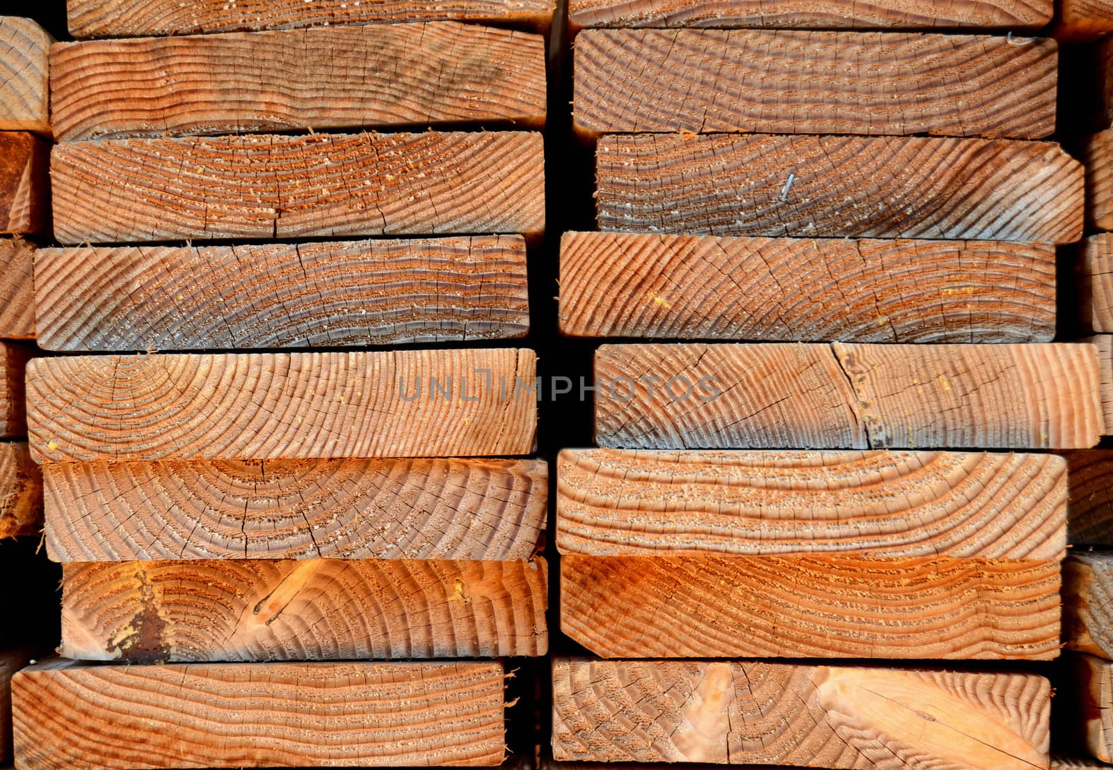 Background Texture Of A Stack Of Timber Planks For The Construction Industry