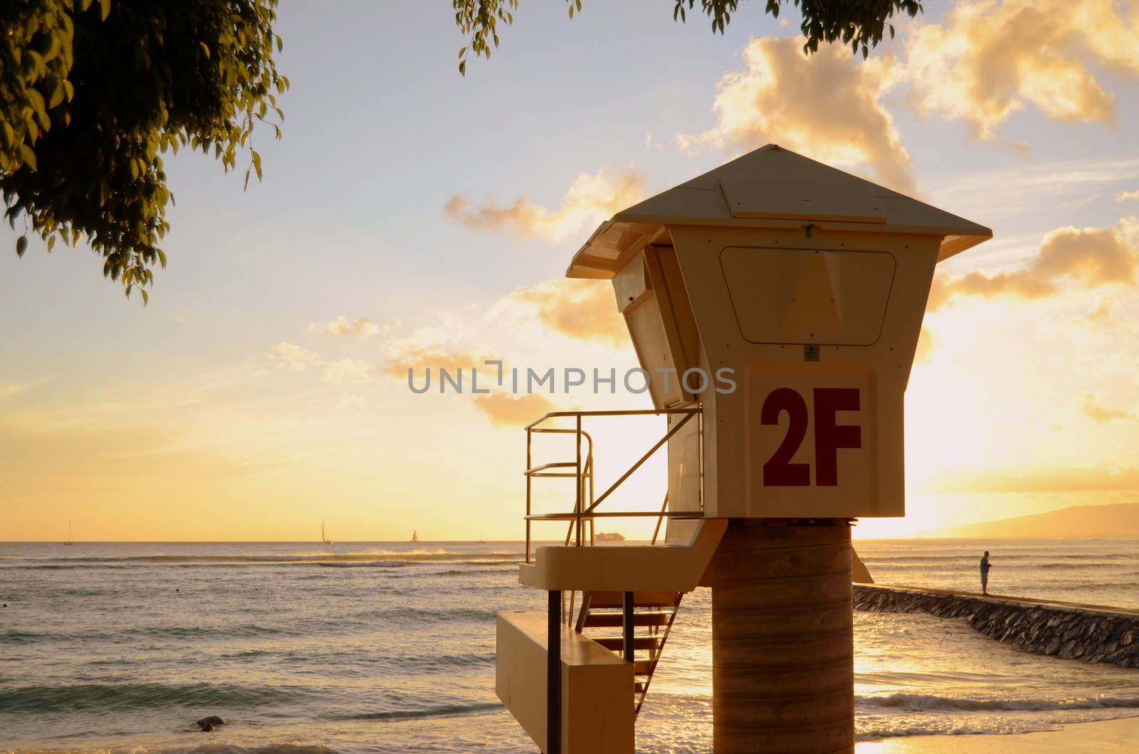 A Lifeguard Station On Waikiki Beach In Hawaii At Sunset