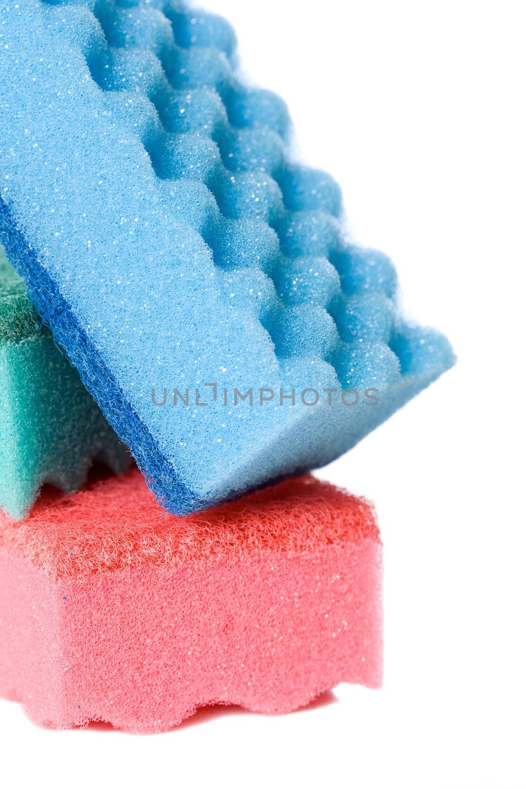 Blue, pink and blue kitchen sponges, isolated on a white background.