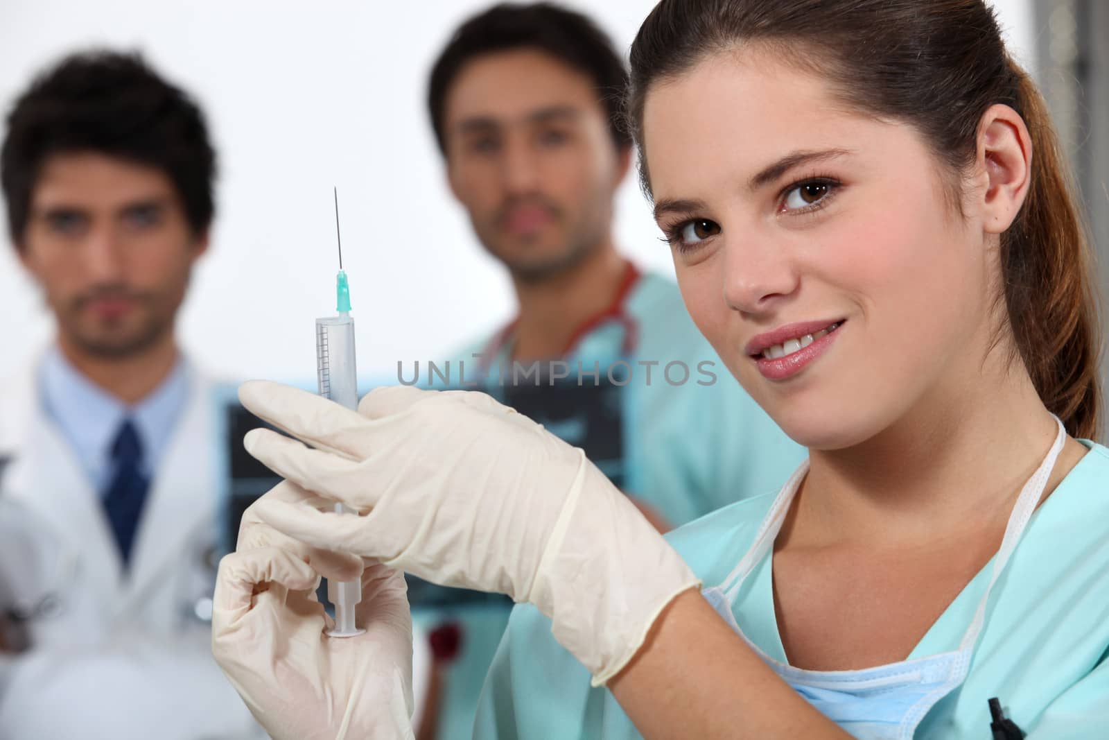Nurse holding needle by phovoir