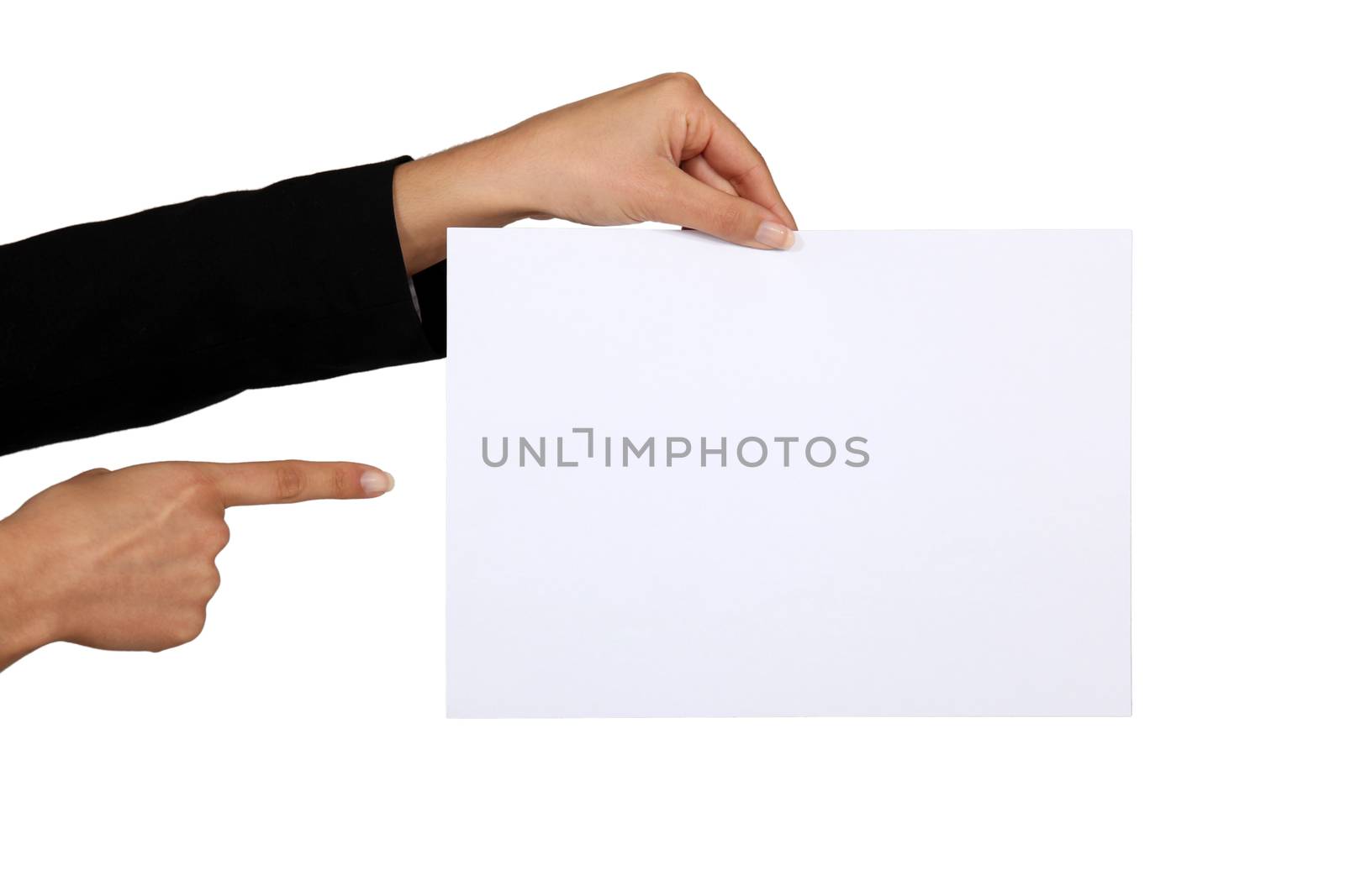 Businesswoman pointing at a blank piece of paper by phovoir