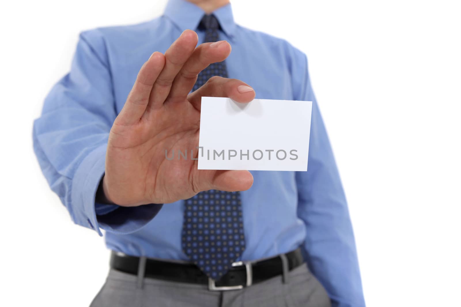 Businessman holding business card by phovoir