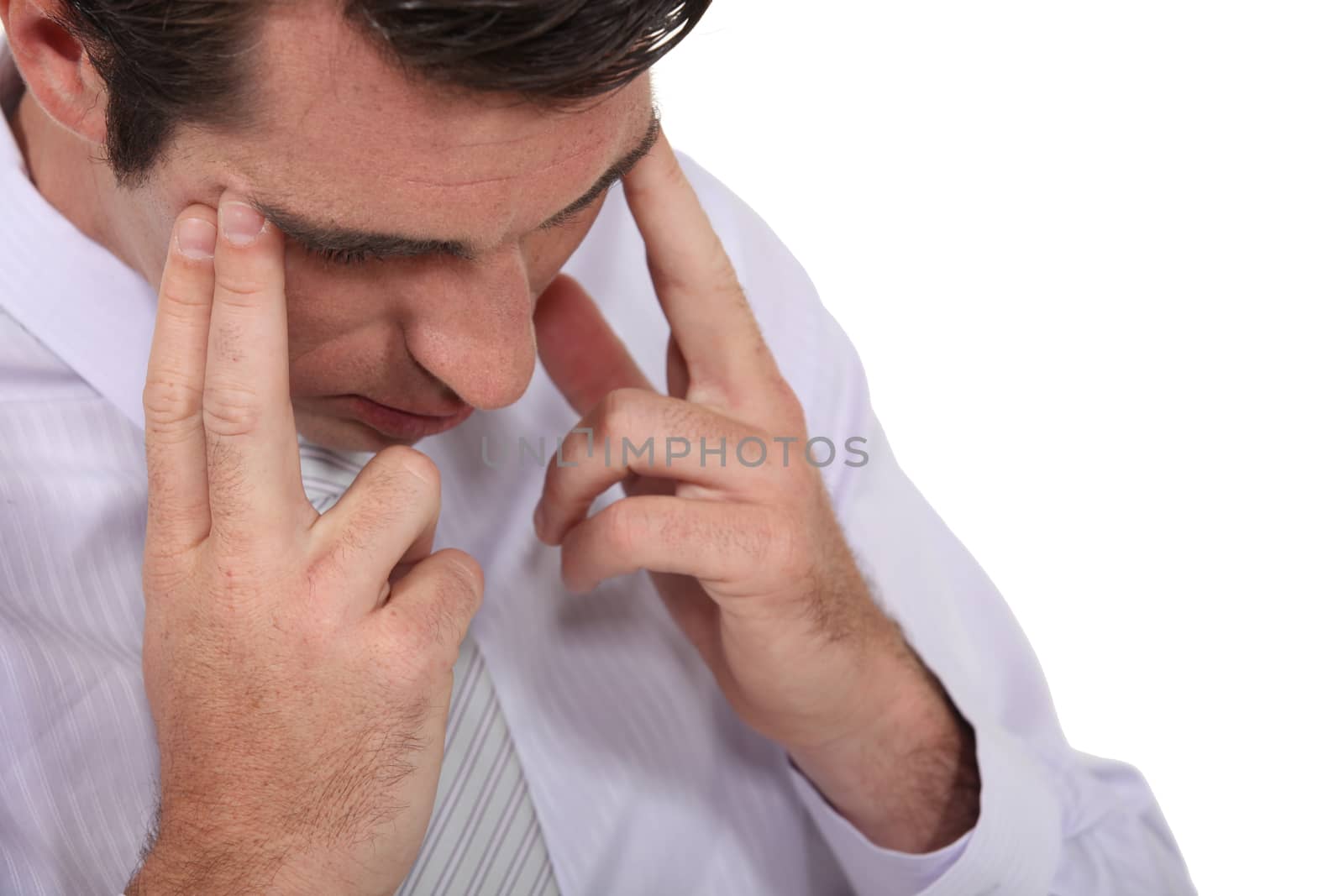 Businessman suffering from headache by phovoir