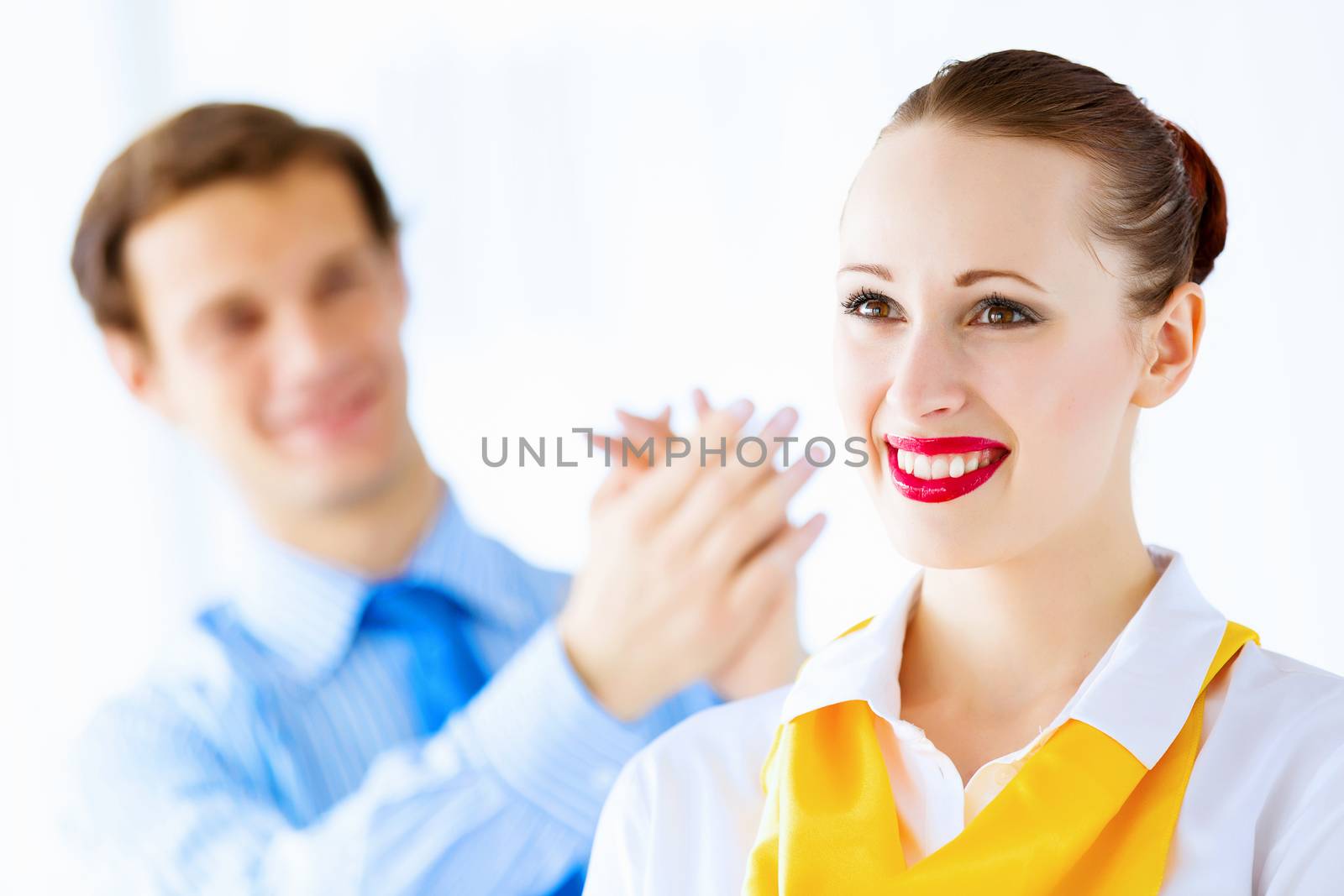 Image of businessman and businesswoman smiling joyfully