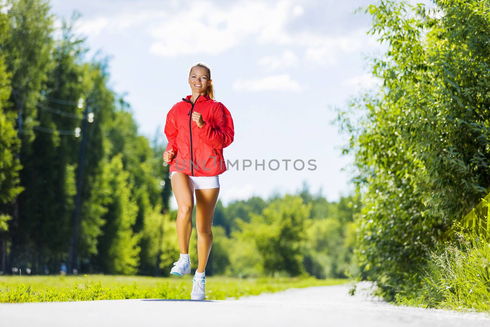 Image of young attractive woman running outdoor