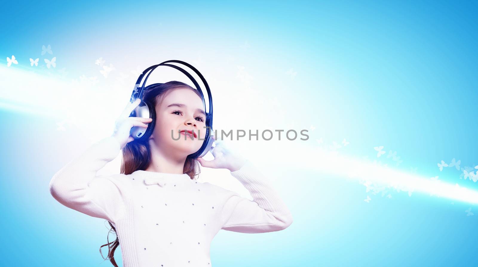 Little girl in headphones by sergey_nivens