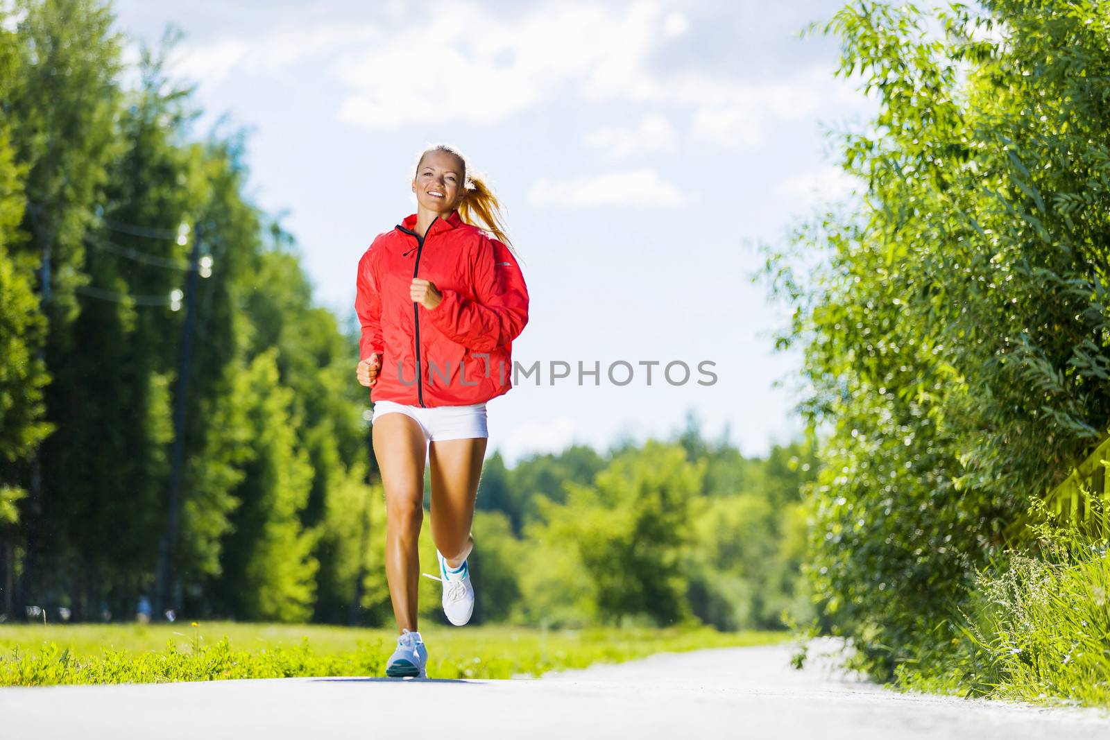 Image of young attractive woman running outdoor