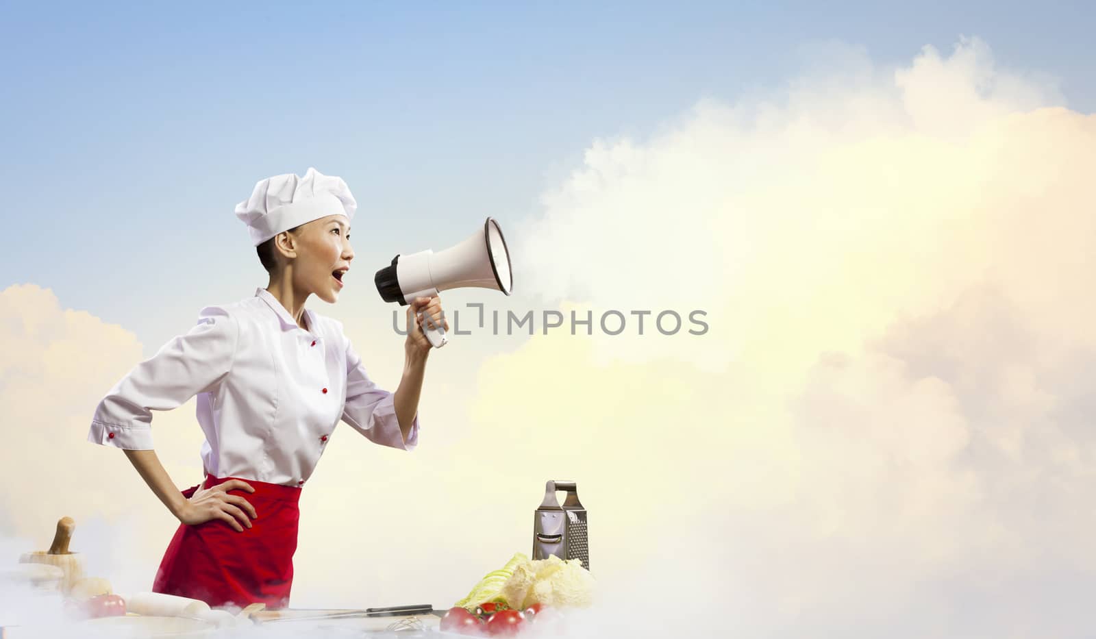 Asian female cook screaming loud in megaphone