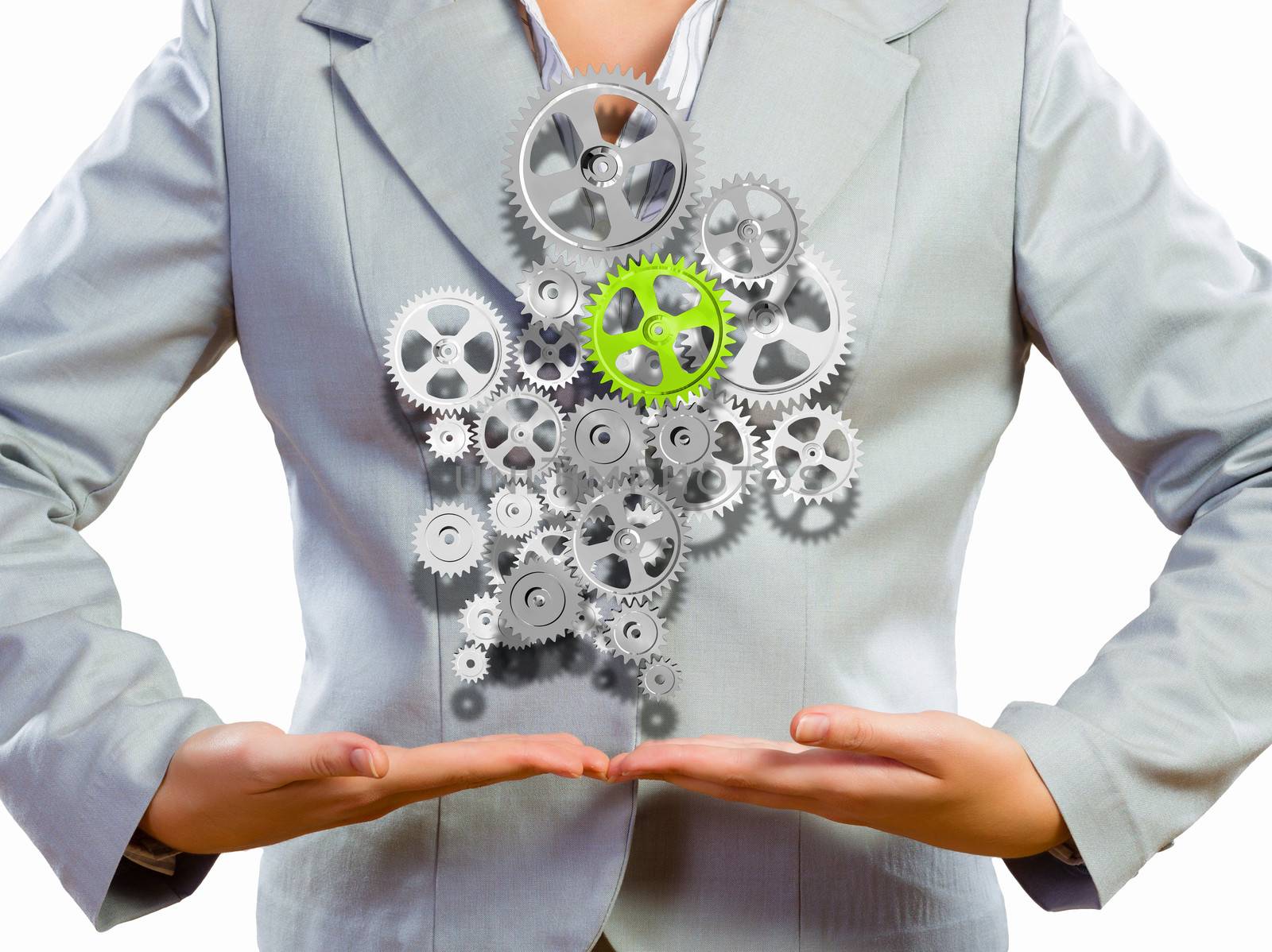 Close up image of businesswoman holding gears in hands