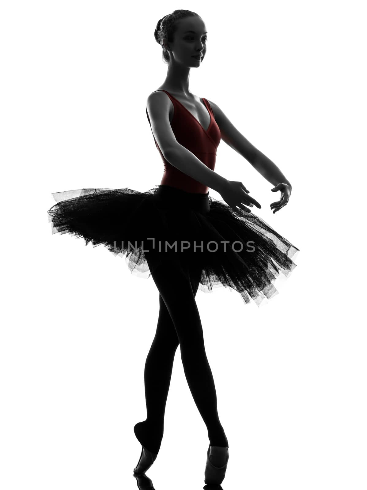 one caucasian young woman ballerina ballet dancer dancing with tutu in silhouette studio on white background