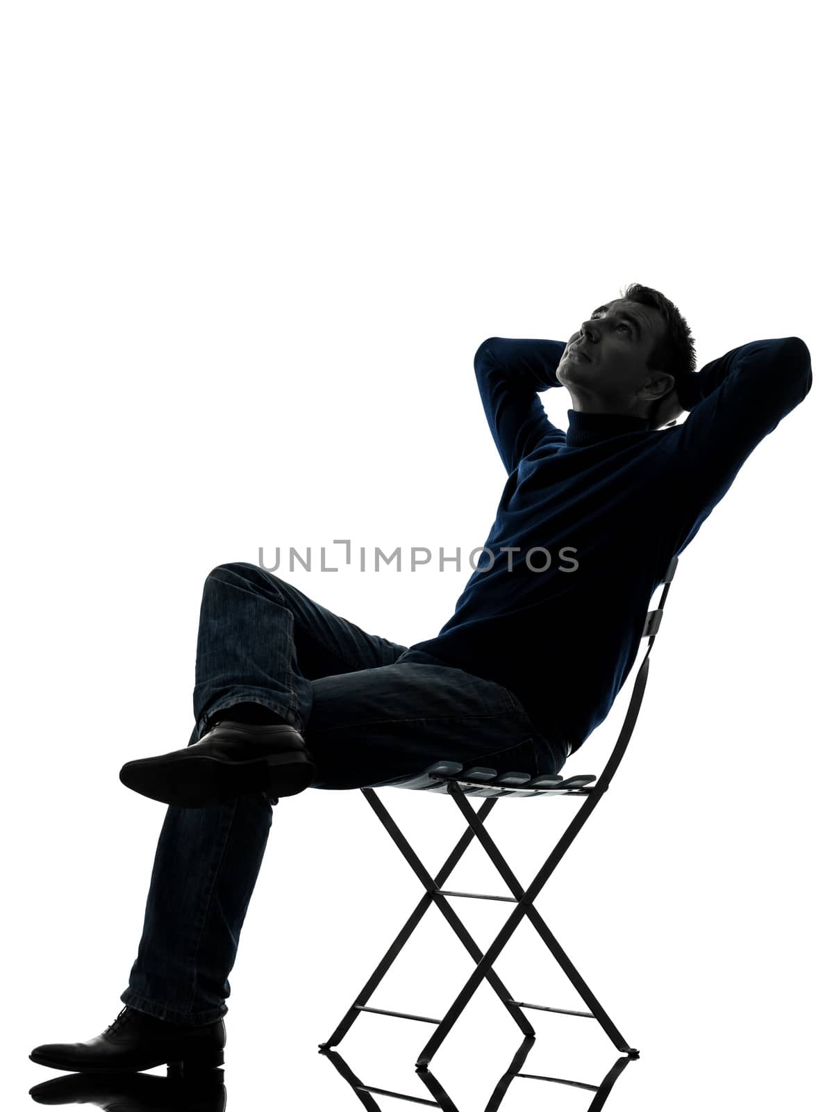 man sitting resting looking up silhouette full length by PIXSTILL