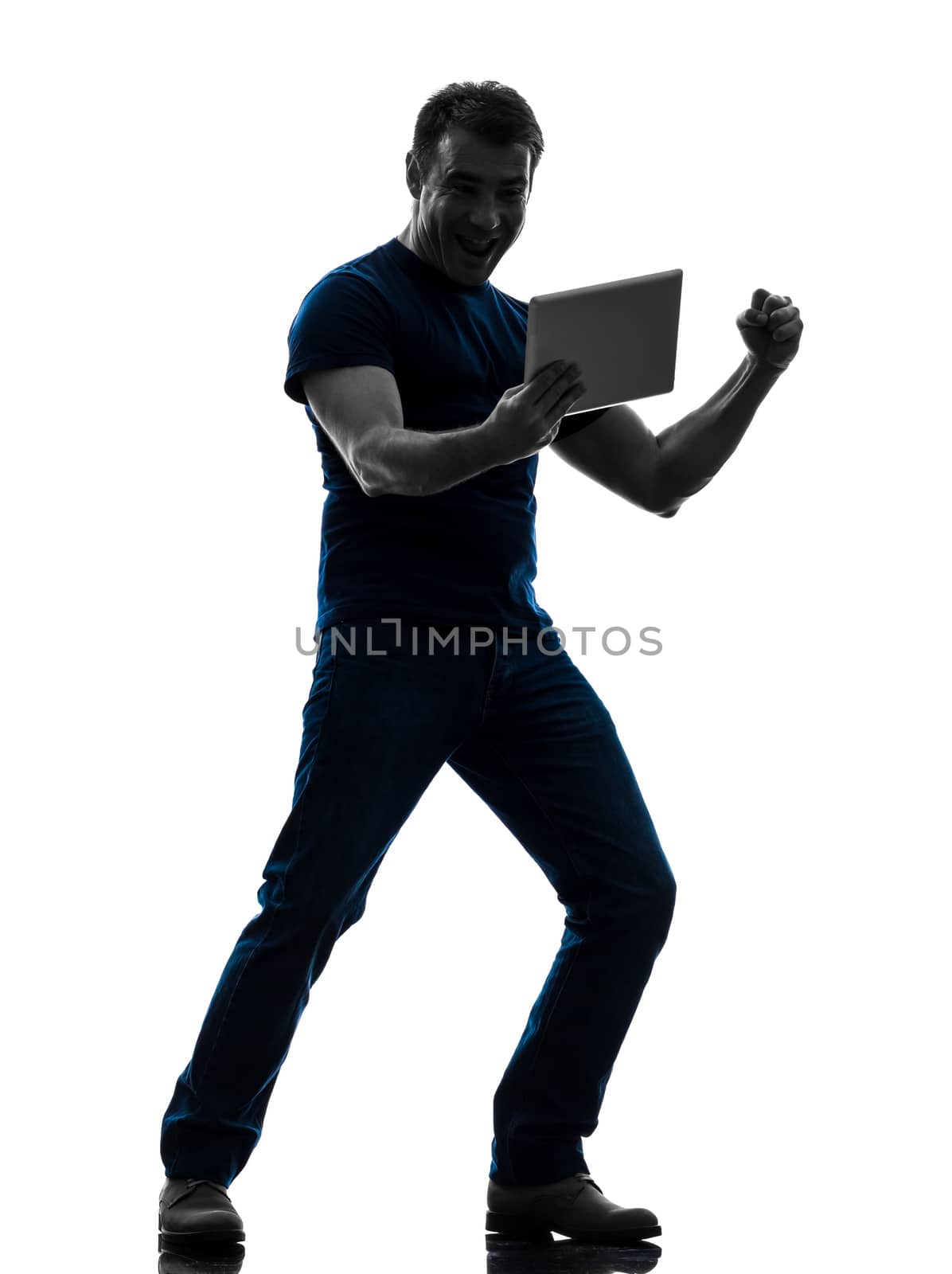 man holding watching  digital tablet  silhouette by PIXSTILL