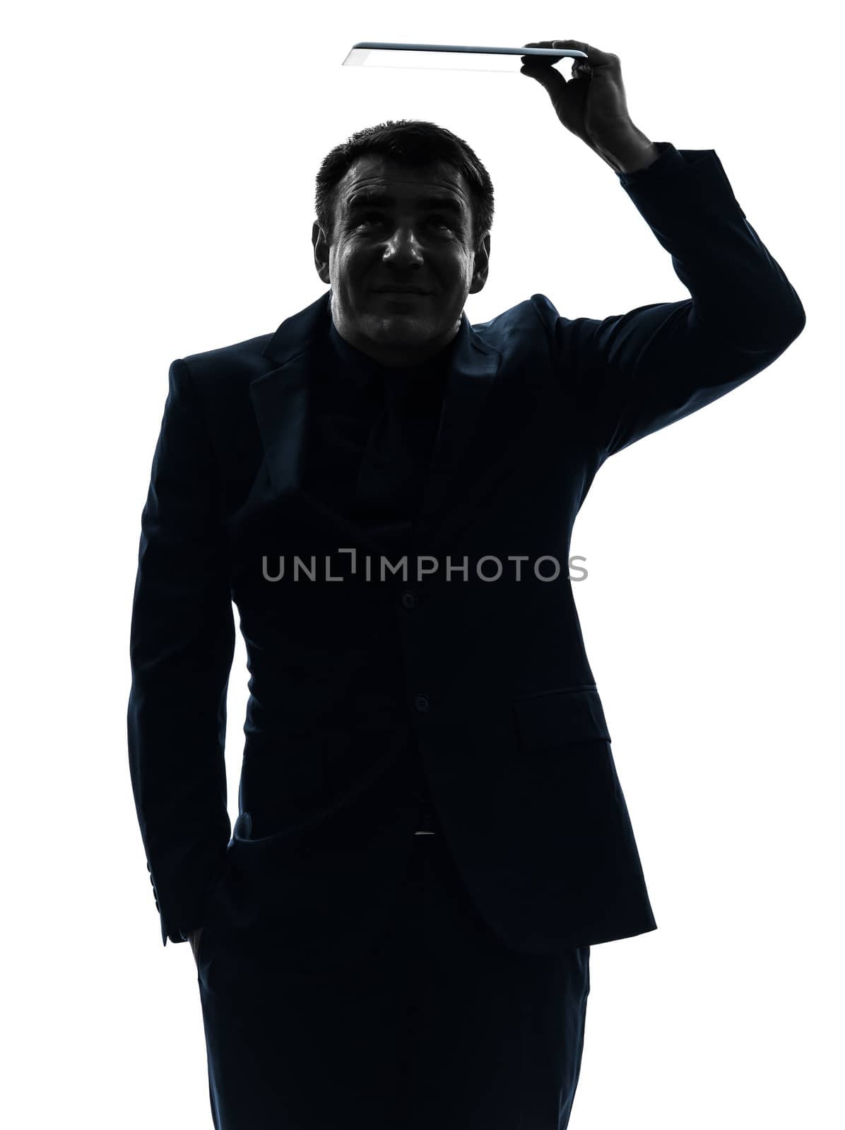 one caucasian business man holding shielding digital tablet   in silhouette on white background