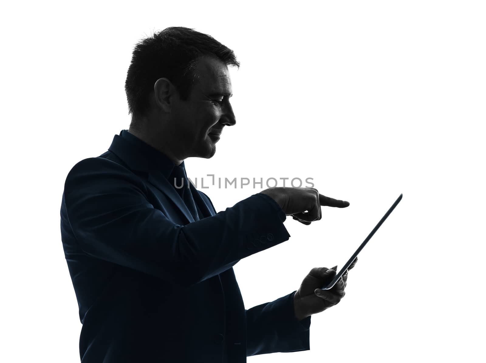 one caucasian business man touchscreen digital tablet   in silhouette on white background