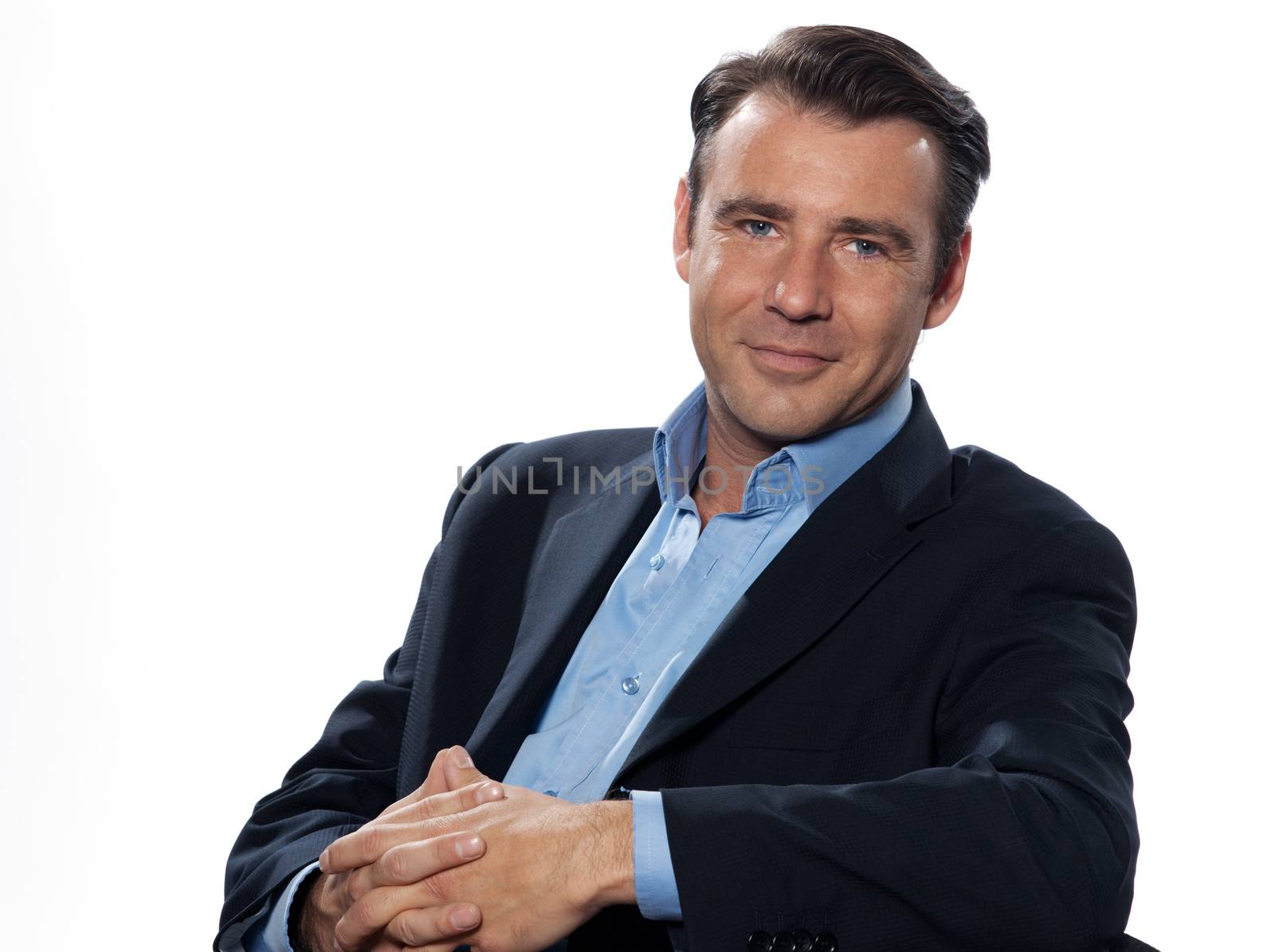 Handsome caucasian man businessman sitting relaxed portrait on white isolated background