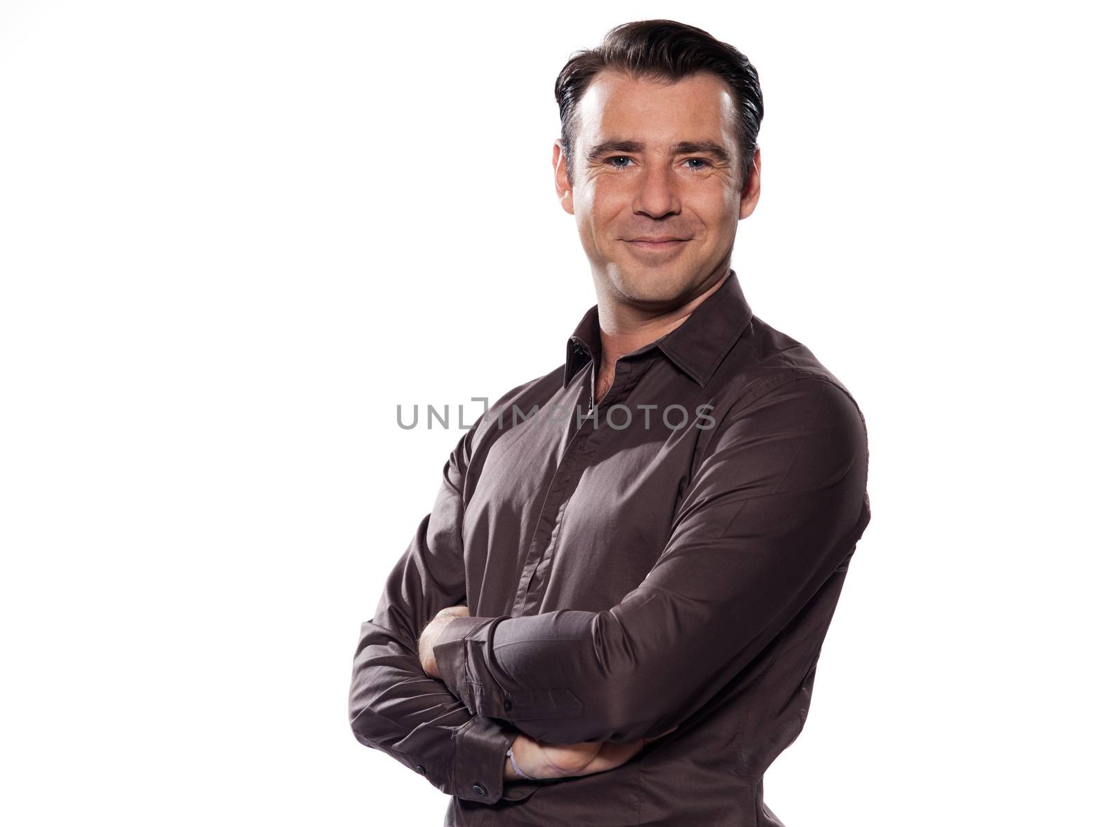 Handsome caucasian man smiling portrait on white isolated background with brown shirt