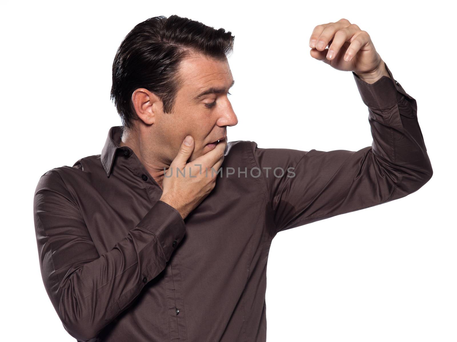 one caucasian man looking at sweat stain  sweating perspiring st by PIXSTILL