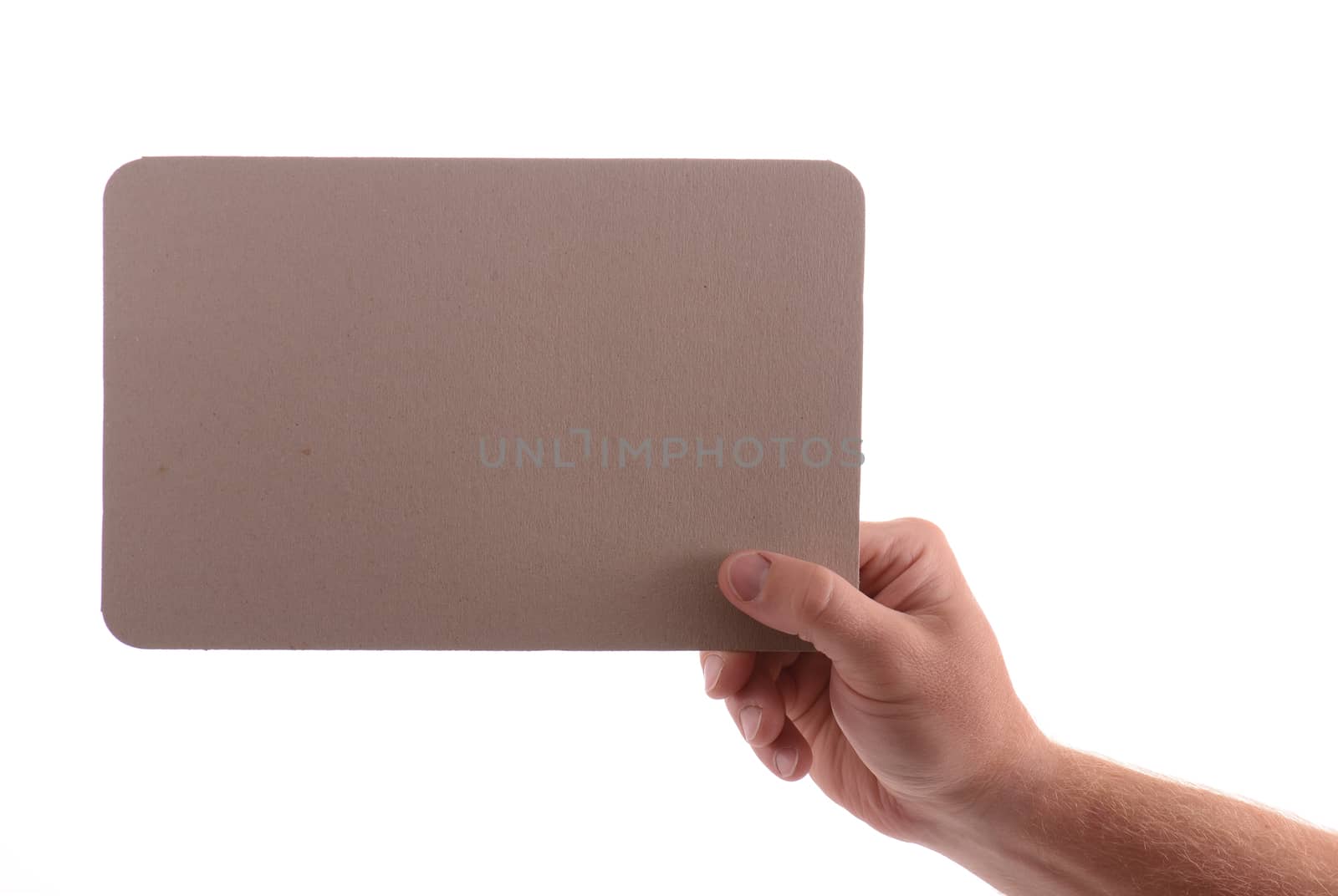 hand holding cardboard card with copy space