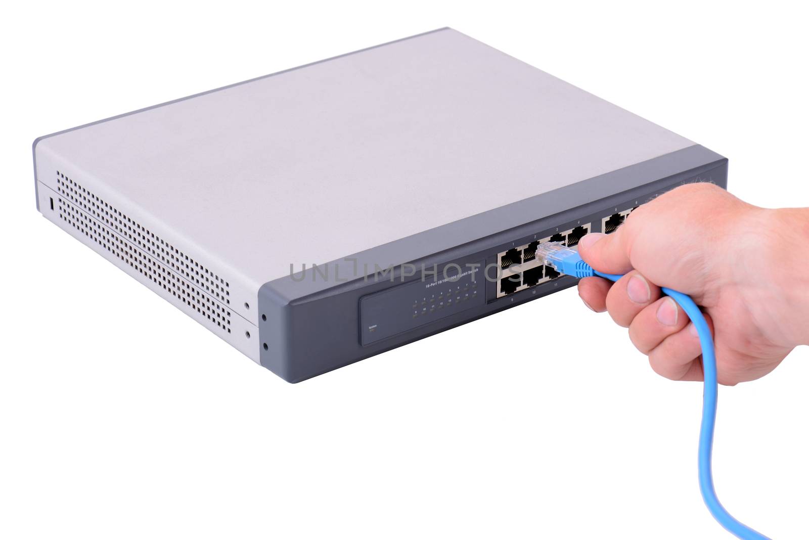 hand pluging an rj45 connector in to a network hub