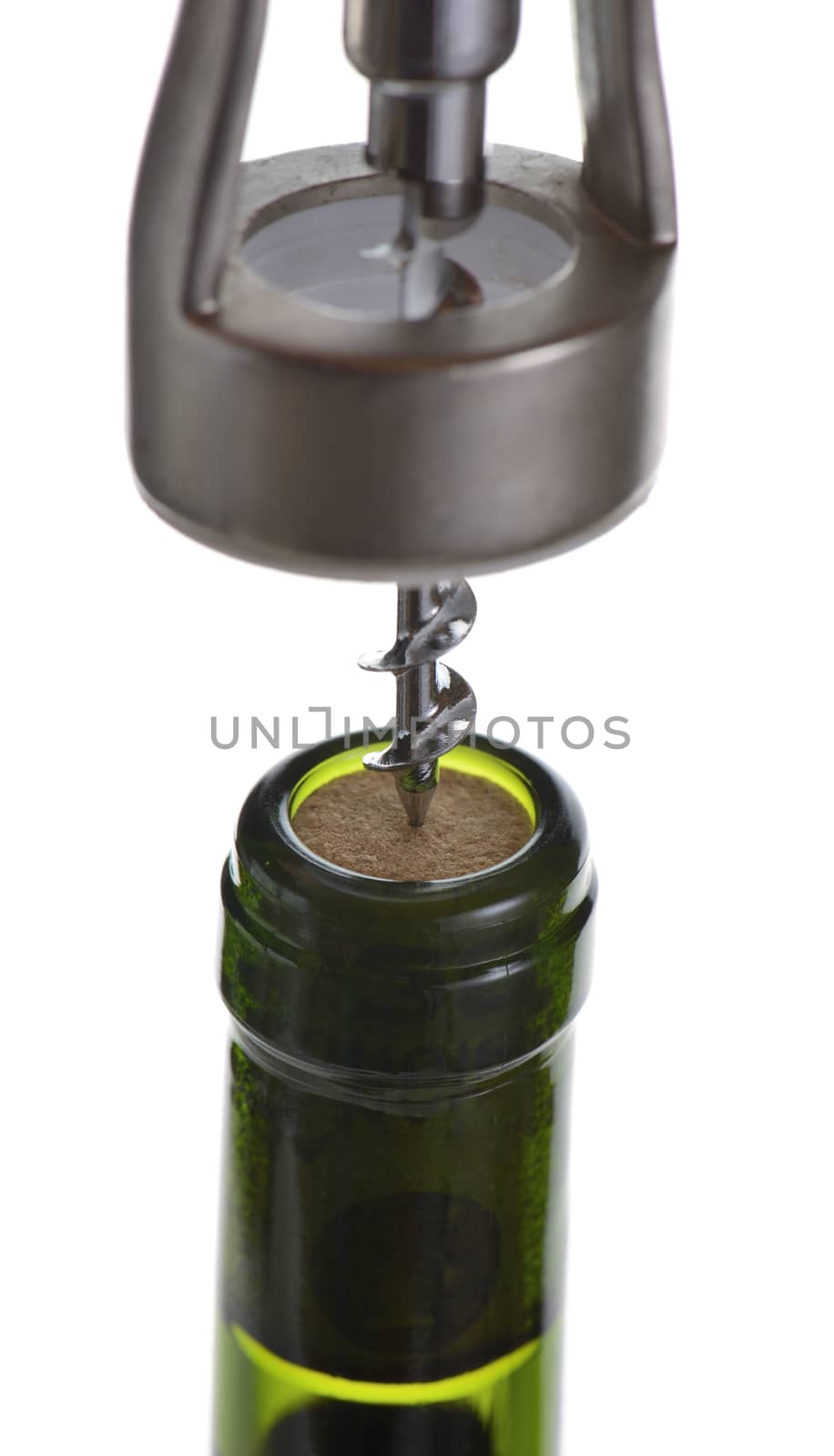 Close macro shot of cork screw opening a bottle of red wine isolated on white